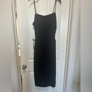 Black lined formal dress with tie keyholes at waist